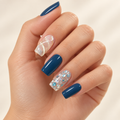 Pattern Play nail art manicure on a warm ivory background